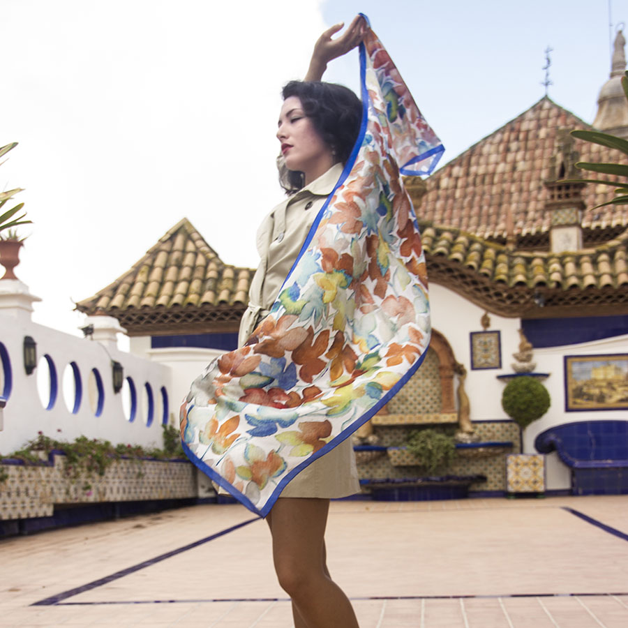 A model is wearing our silk scarf "Malvasia de Sitges B" in the Maricel Palace terrace - Autumn silk scarves collection